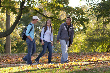 Students walkng on campus in the fall