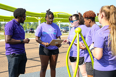 Students doing an outdoor research project in summer