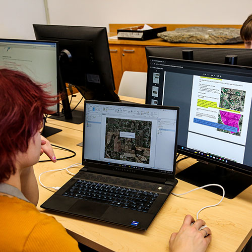 Students mapping earth geography in GIS lab