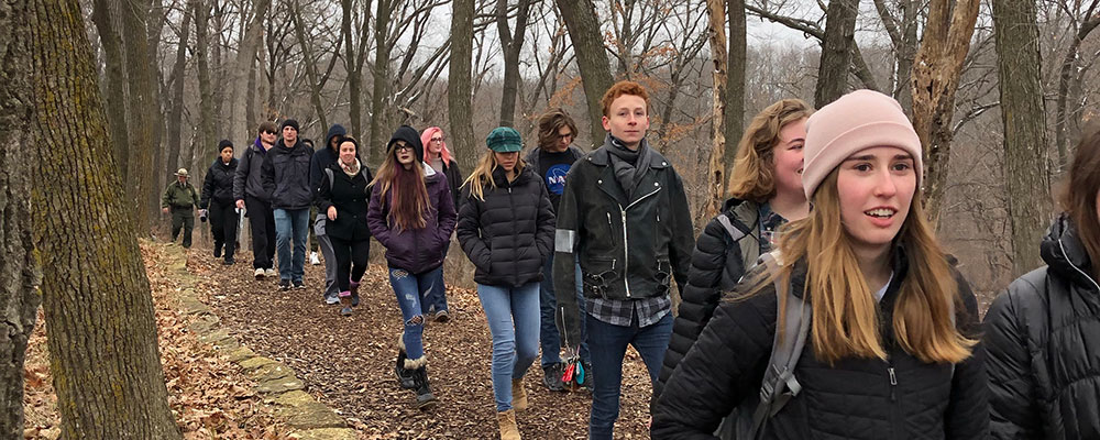 Cornell students hiking to the Effigy Mounds.