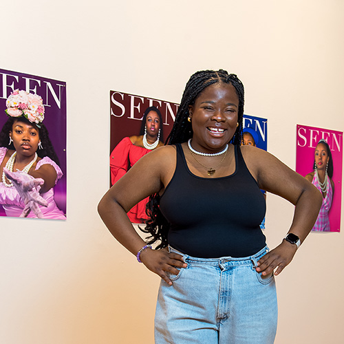 Senior art student with her senior show displayed in Luce Gallery