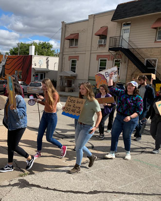 Cornell College students on an activist march in Mount Vernon, Iowa