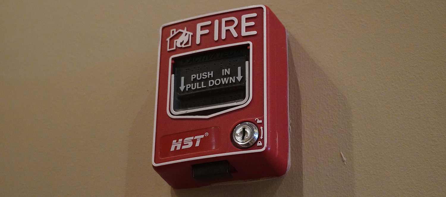 Fire alarm mounted to a wall