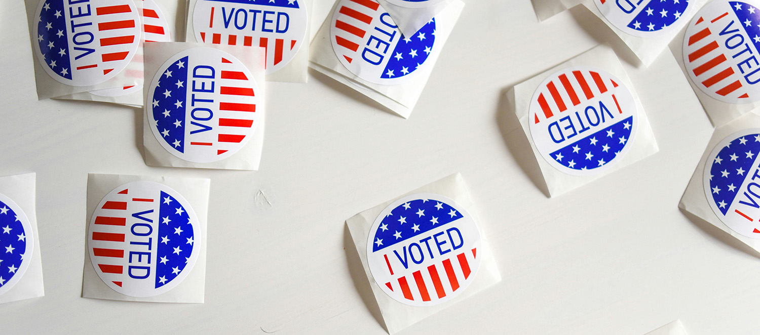 Table with "I voted" stickers strewn across it