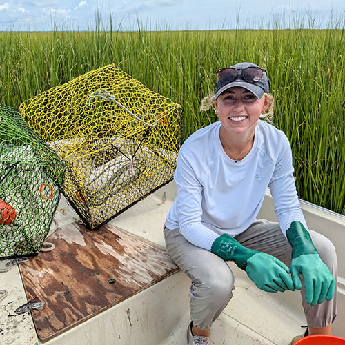 Cornell intern in a boat duing internship at the Baruche Marine Field Laboratory