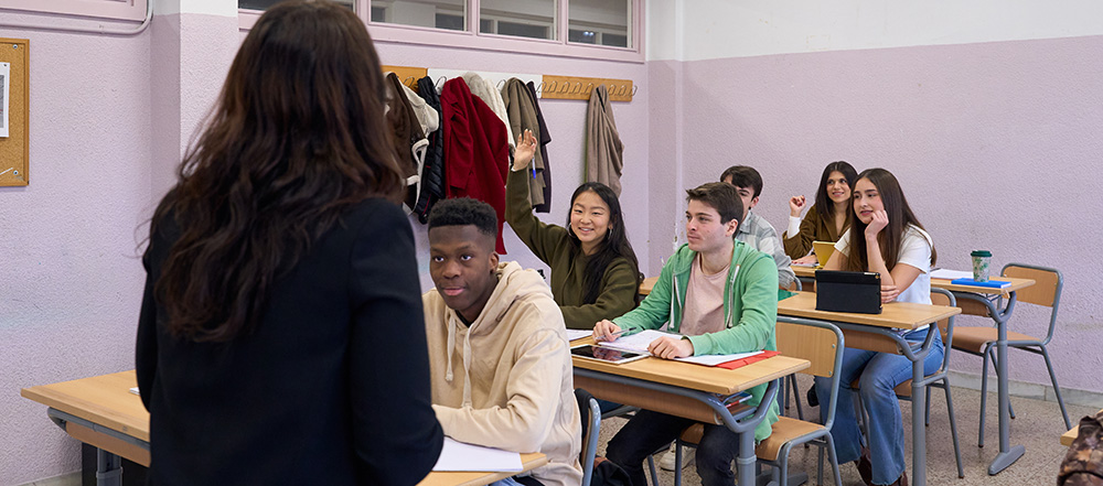 Teacher and students in secondary school classroom: stock photo