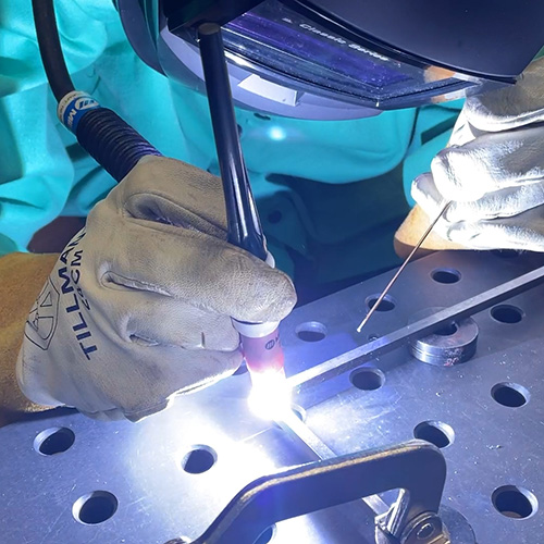 Engineering student working on a welding project.