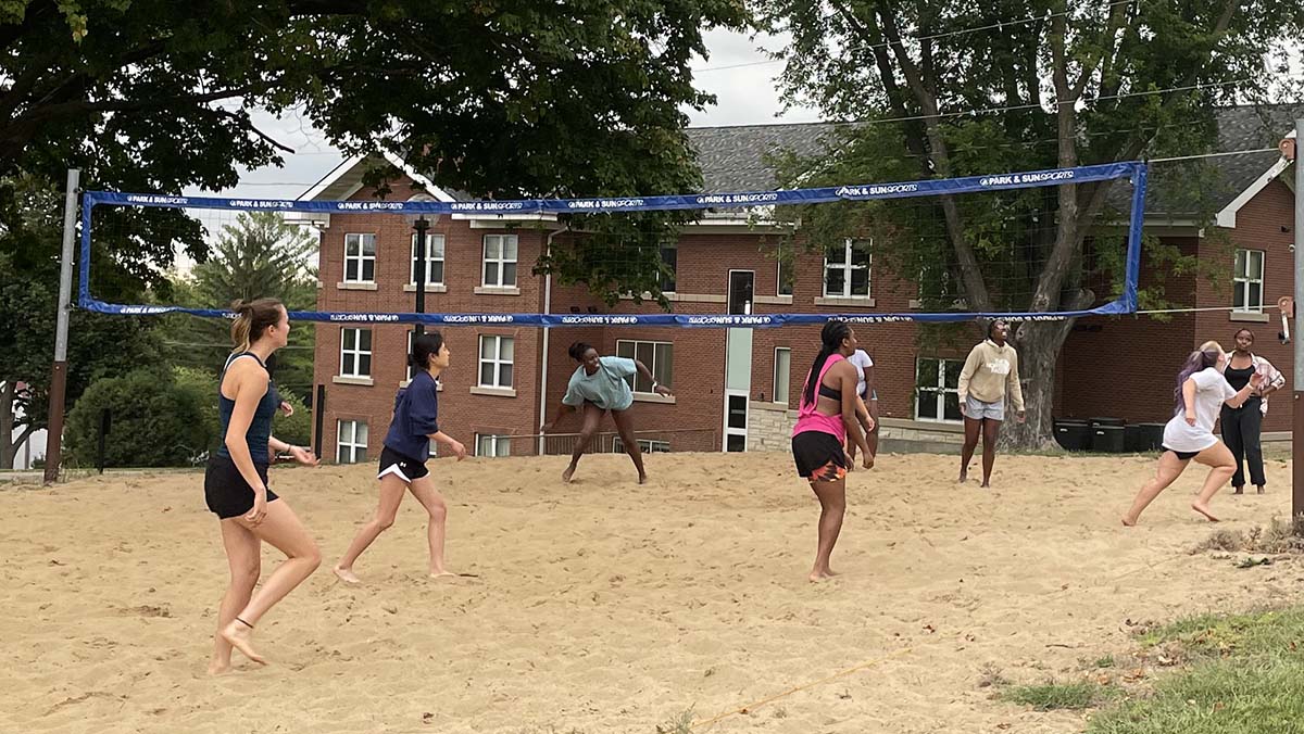 Students playing sand volleyball at Cornell College
