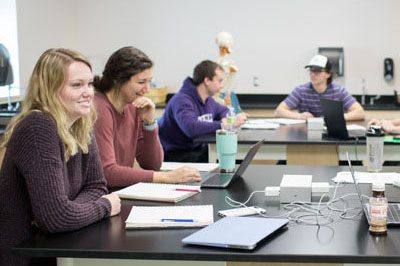 Students at tables in science classroom