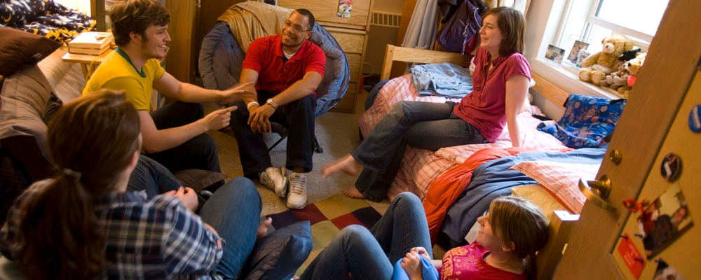 Students gather in a res hall room